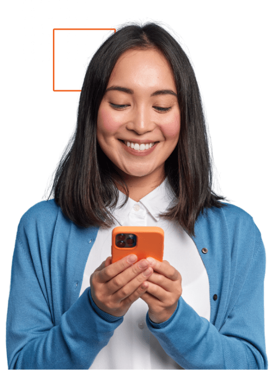 Woman smiling and using phone